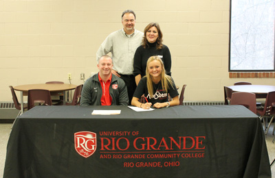 Turpin High's Brooke Keipper poses with Rio Grande head coach Callum Morris and her parents after signing with the RedStorm